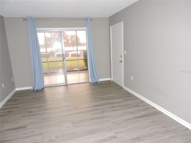 711 Springer Dr Unit 2, Lake Wales, FL 33853 - spare room featuring baseboards and light wood finished floors