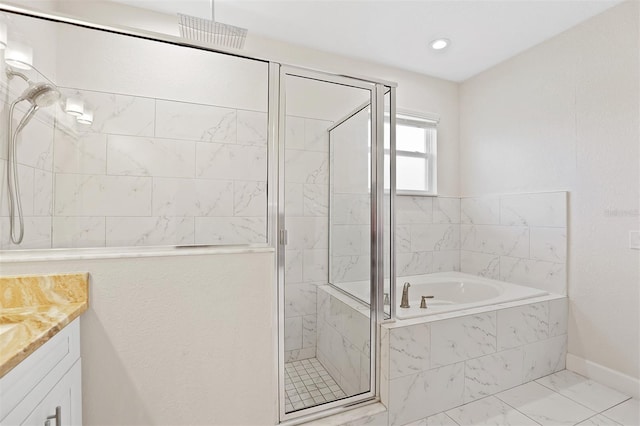 bathroom featuring vanity and plus walk in shower