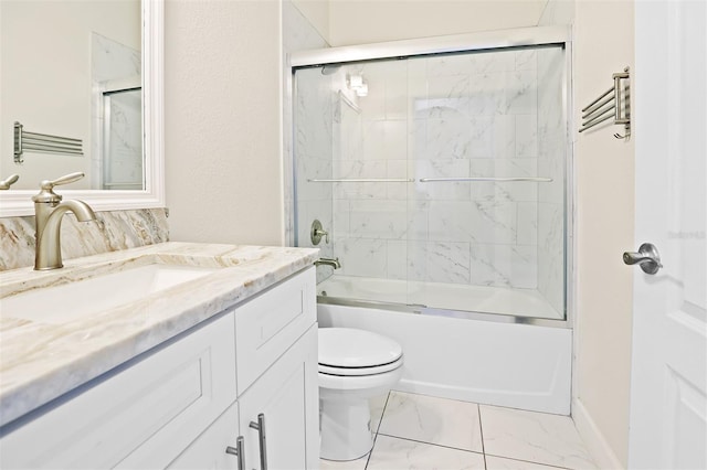 full bathroom featuring vanity, enclosed tub / shower combo, and toilet