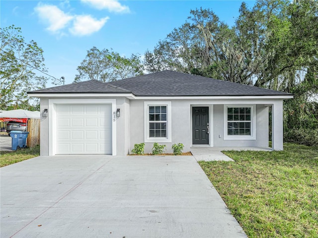 ranch-style home with a front yard and a garage