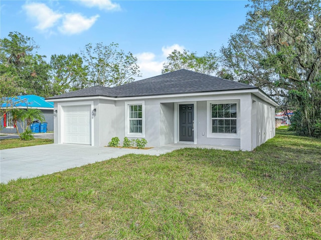 ranch-style house featuring a front lawn and a garage