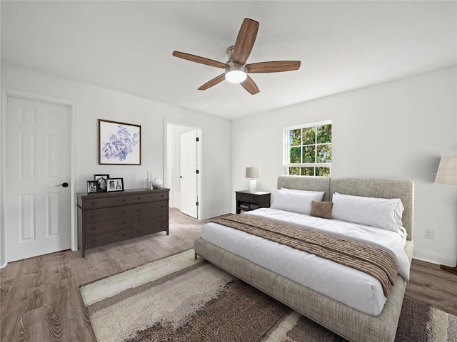 bedroom featuring wood-type flooring and ceiling fan