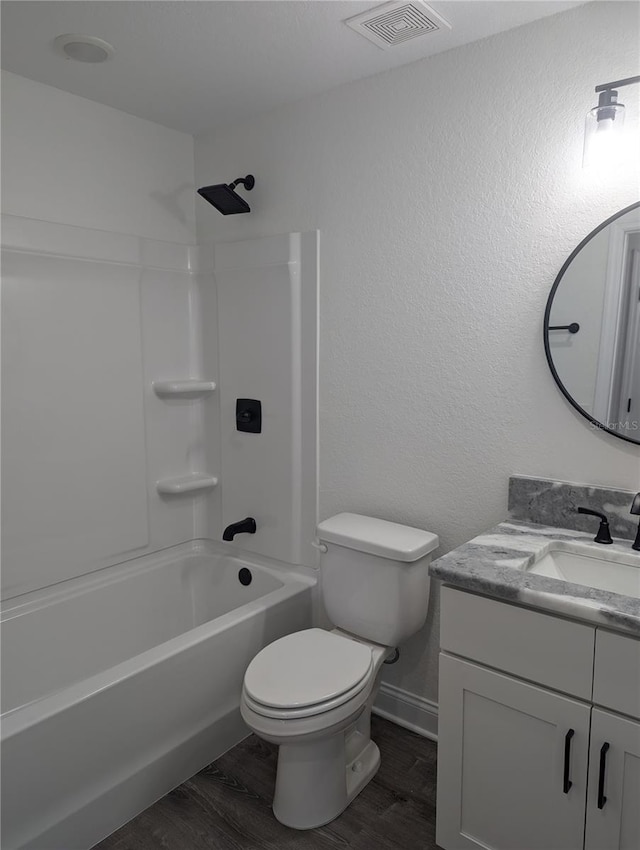 full bathroom featuring shower / bathing tub combination, vanity, toilet, and wood-type flooring