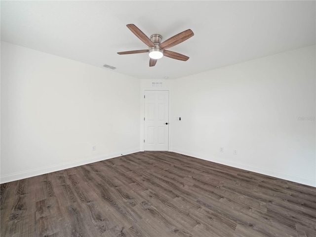 empty room with ceiling fan and dark wood-type flooring