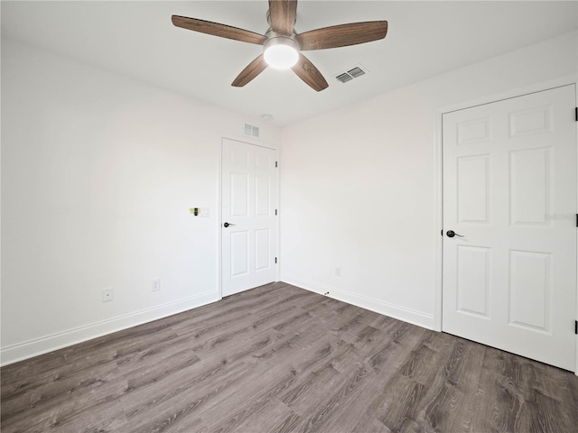 unfurnished room featuring hardwood / wood-style floors and ceiling fan