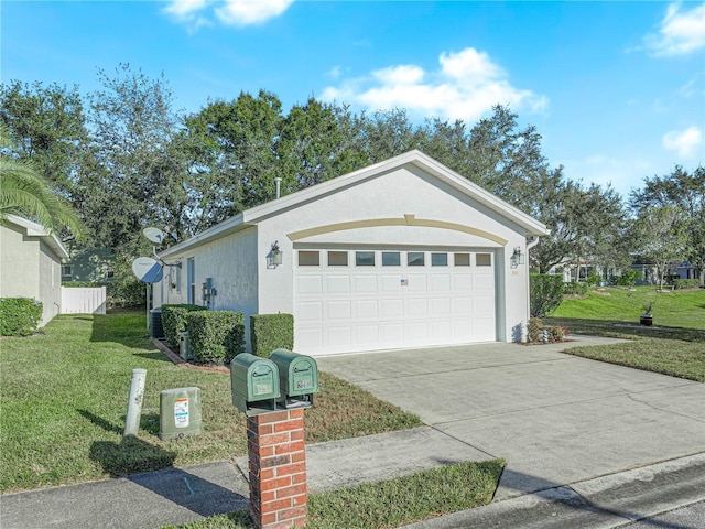 view of front of home with a garage and a front lawn