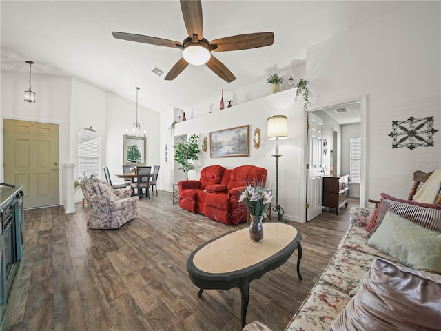 living room with dark hardwood / wood-style flooring, high vaulted ceiling, and ceiling fan