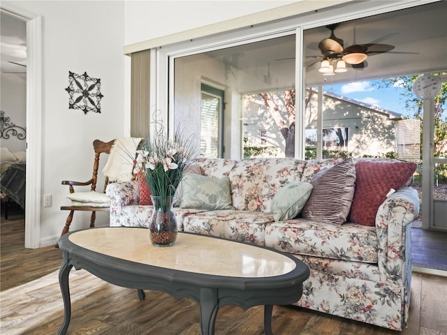 living room with hardwood / wood-style flooring and ceiling fan