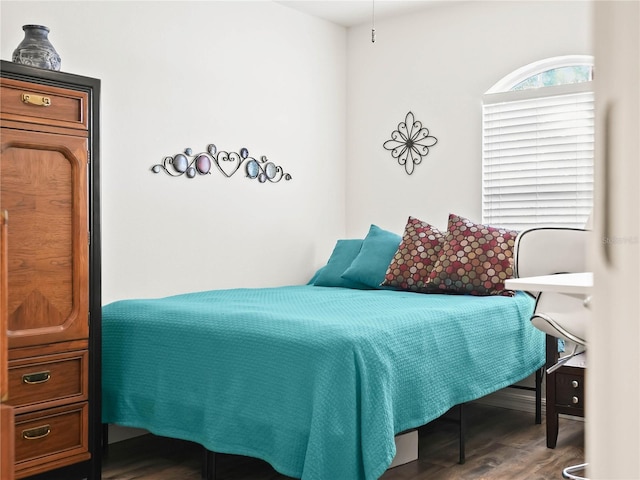 bedroom with hardwood / wood-style flooring