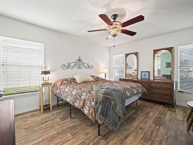 bedroom featuring ceiling fan and dark wood-type flooring