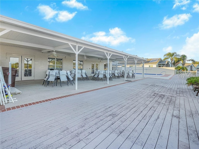 341 Lake Suzanne Dr, Lake Wales, FL 33859 - wooden deck with outdoor dining area and a ceiling fan