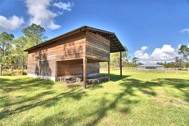 view of outdoor structure with a yard