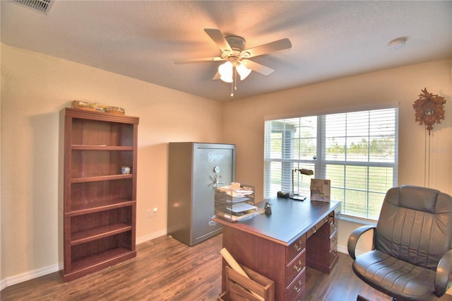 office space featuring ceiling fan, dark hardwood / wood-style flooring, and a textured ceiling