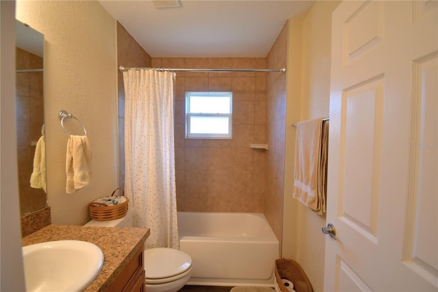 full bathroom featuring vanity, toilet, and shower / tub combo with curtain