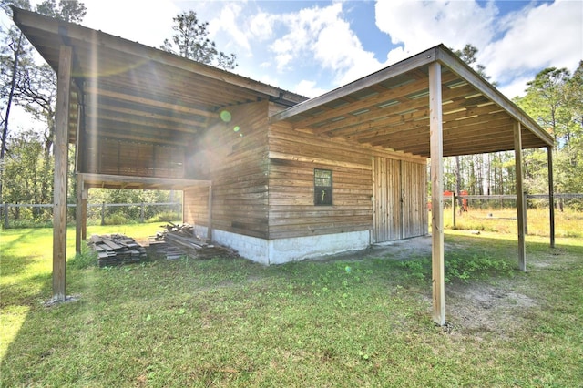 view of side of home featuring a lawn