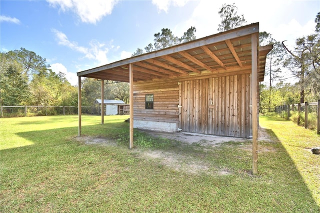 view of outdoor structure with a yard