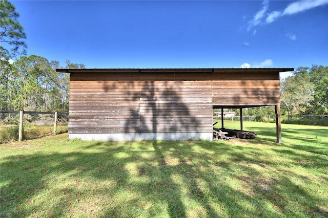 view of outdoor structure with a yard