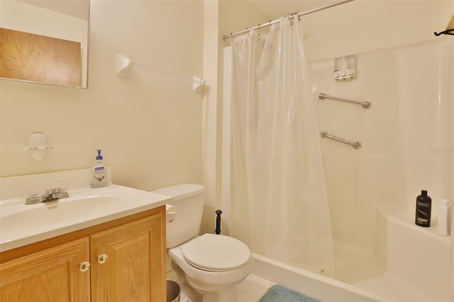 bathroom featuring vanity, a shower with shower curtain, and toilet