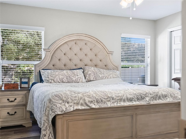 bedroom featuring dark hardwood / wood-style flooring and ceiling fan