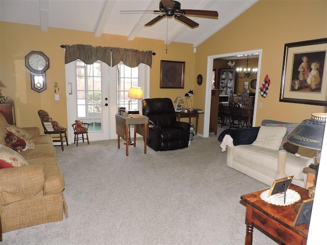 carpeted living room with ceiling fan, french doors, and vaulted ceiling with beams