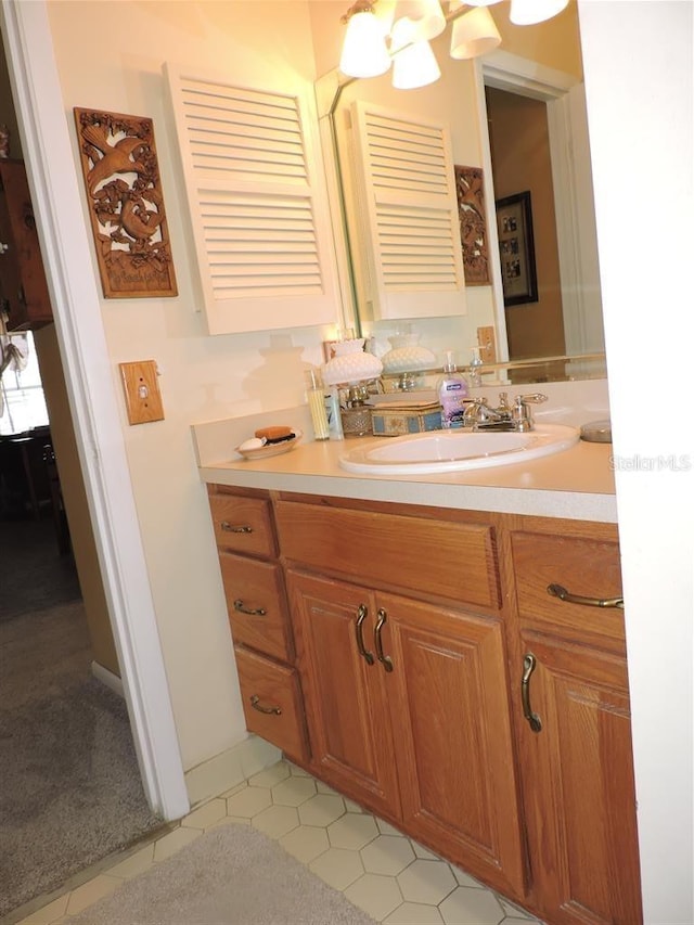 bathroom featuring tile patterned flooring and vanity