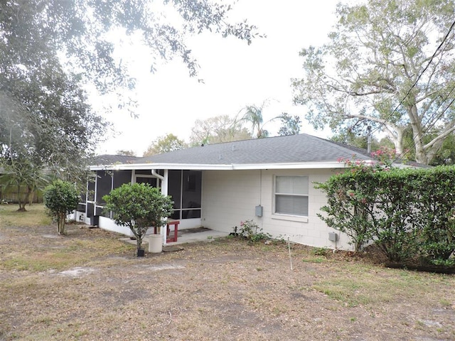 view of front of home featuring a sunroom