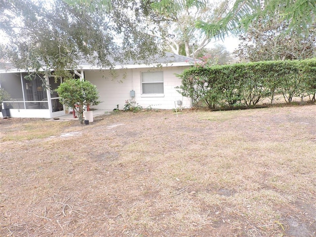 view of yard with a sunroom