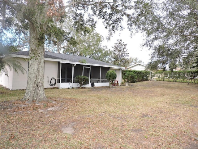 view of yard featuring a sunroom