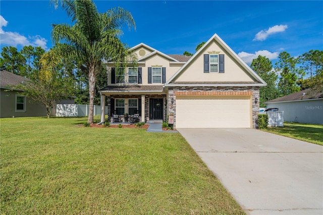 view of front of home with a porch, a garage, and a front yard