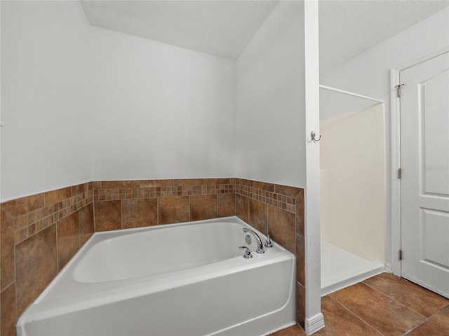 bathroom featuring separate shower and tub and tile patterned flooring