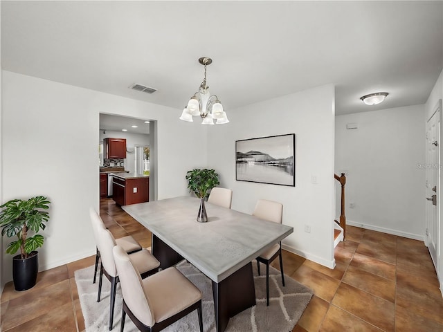 dining space featuring a notable chandelier