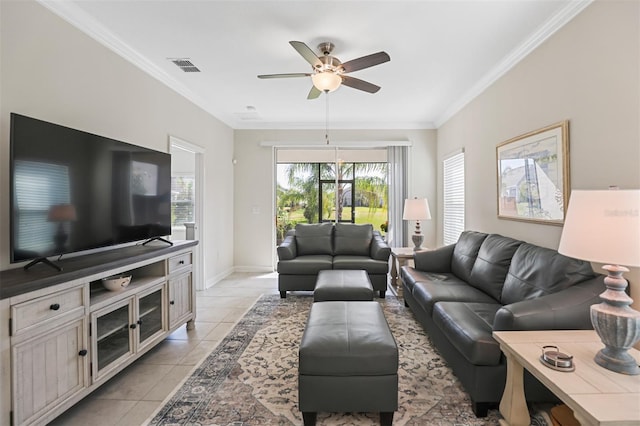 living room with ceiling fan, light tile patterned floors, and ornamental molding