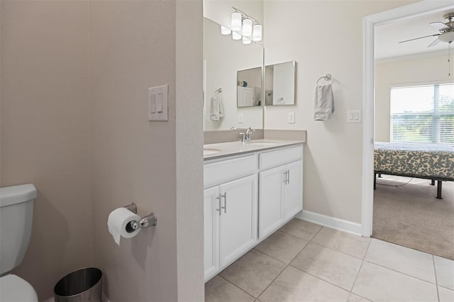 bathroom with vanity, ceiling fan, crown molding, tile patterned flooring, and toilet