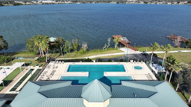 view of swimming pool featuring a water view