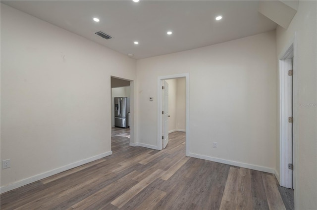 empty room with dark hardwood / wood-style floors