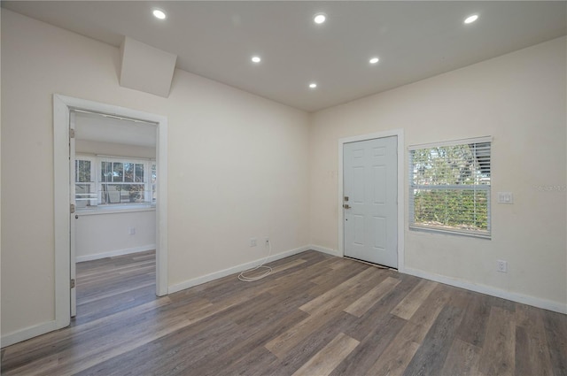 unfurnished room featuring dark hardwood / wood-style flooring