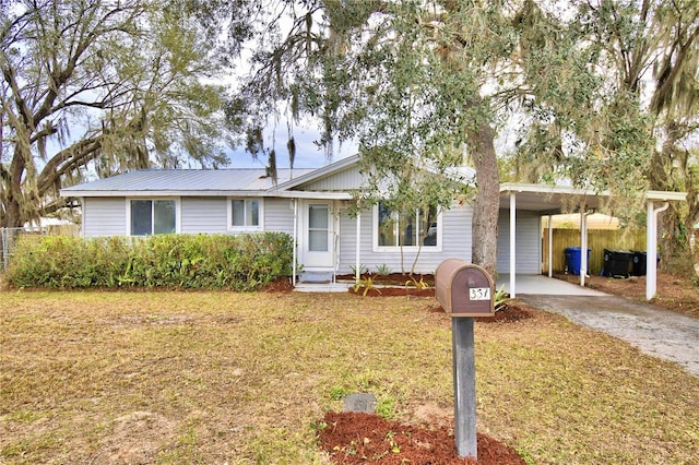 single story home with a carport and a front yard