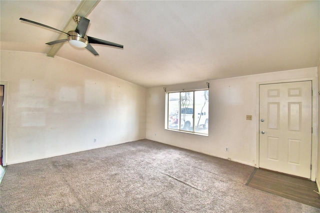 interior space with lofted ceiling and ceiling fan