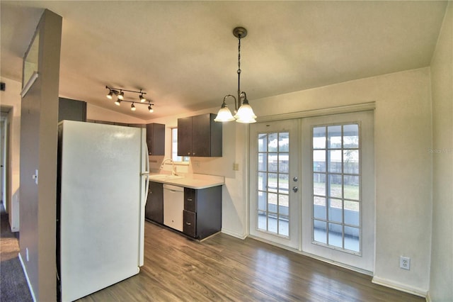 kitchen featuring a notable chandelier, wood-type flooring, sink, white appliances, and french doors