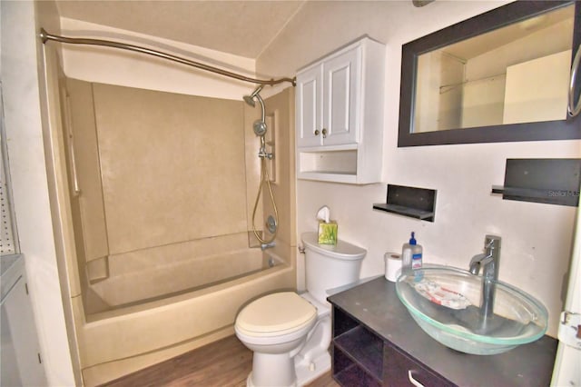 full bathroom featuring hardwood / wood-style floors, shower / bathing tub combination, vanity, and toilet