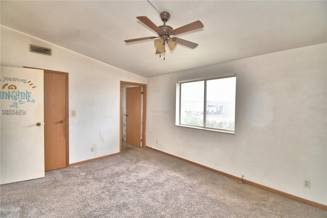 carpeted empty room featuring lofted ceiling and ceiling fan