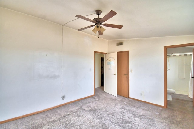 spare room with ceiling fan, light colored carpet, and vaulted ceiling