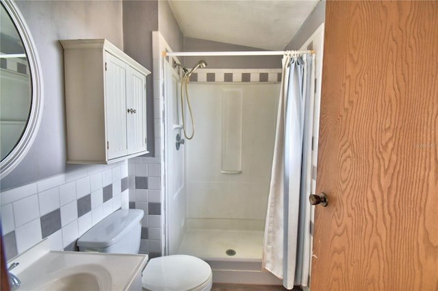 bathroom with lofted ceiling, vanity, a shower with curtain, decorative backsplash, and toilet