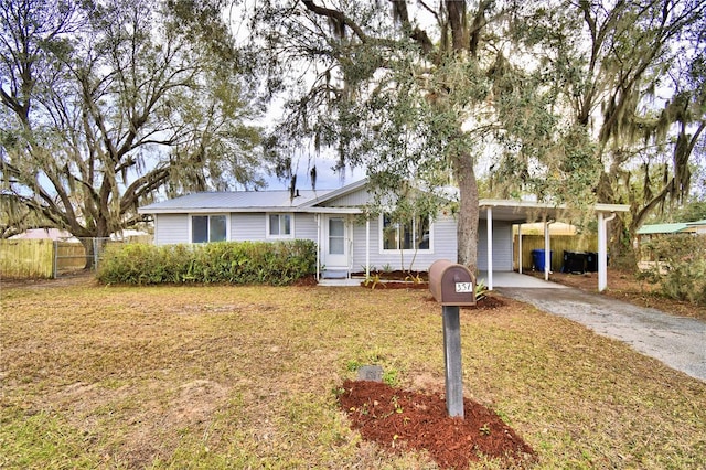 ranch-style house with a front lawn and a carport