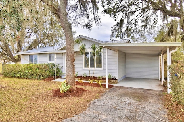 ranch-style home with a carport