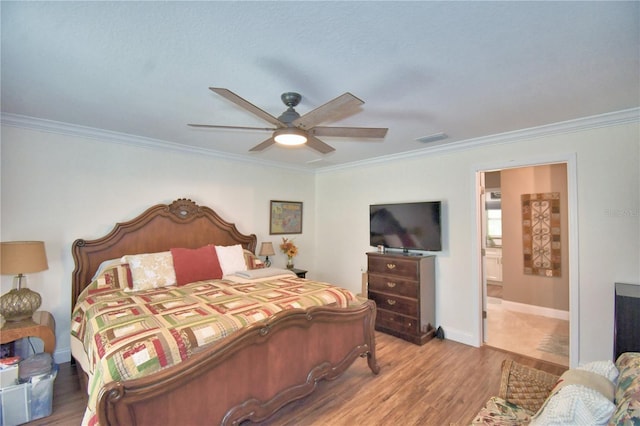 bedroom with baseboards, visible vents, a ceiling fan, ornamental molding, and wood finished floors