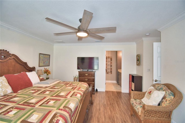 bedroom with a ceiling fan, baseboards, ornamental molding, and wood finished floors