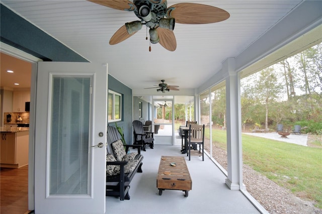 view of patio / terrace with ceiling fan, an outdoor kitchen, and outdoor dining space