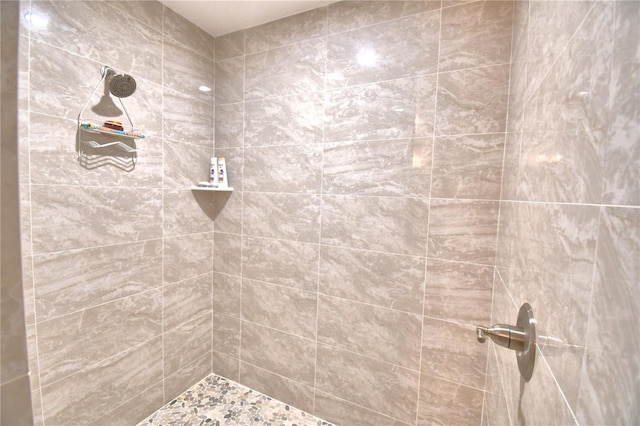 full bath featuring tiled shower