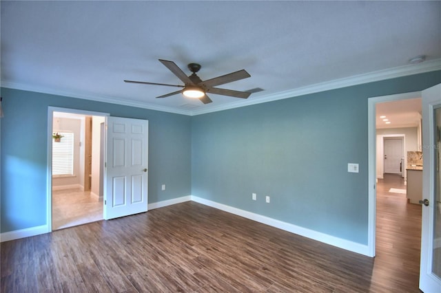 112 Reedy Creek Dr, Frostproof, FL 33843 - unfurnished bedroom with dark wood finished floors, ornamental molding, and a ceiling fan